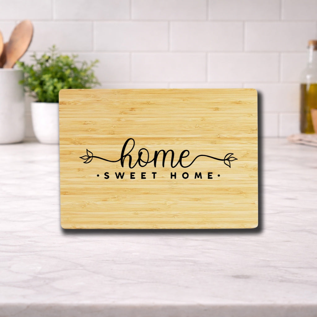 Engraved cutting board with the phrase 'home sweet home' beautifully designed for kitchen use.
