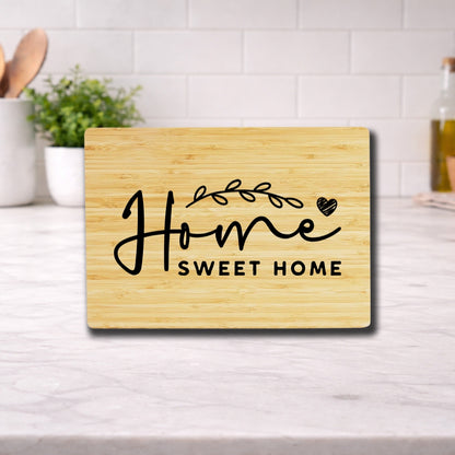 Engraved cutting board with the phrase 'home sweet home' beautifully designed for kitchen use.