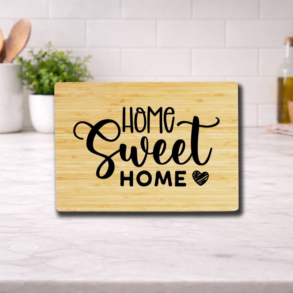 Engraved cutting board with the phrase 'home sweet home' beautifully designed for kitchen use.