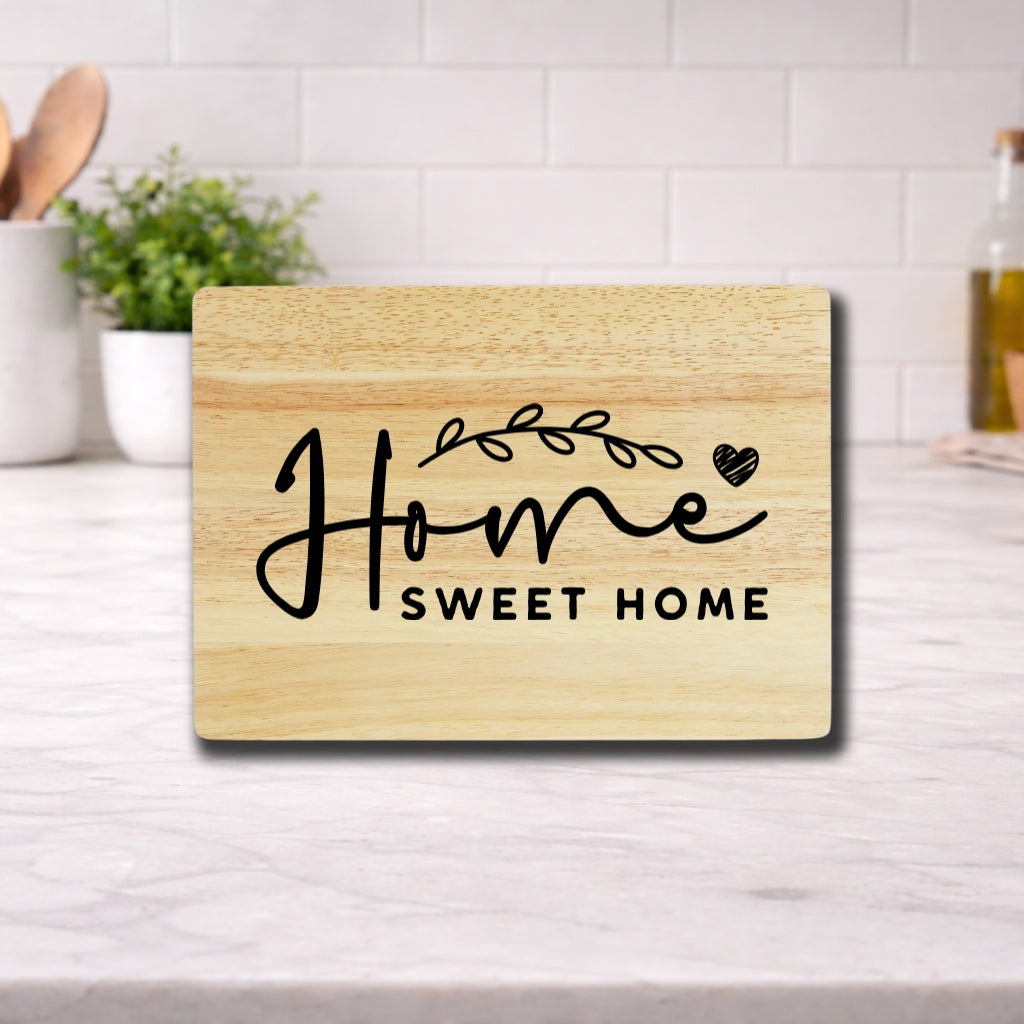 Engraved cutting board with the phrase 'home sweet home' beautifully designed for kitchen use.