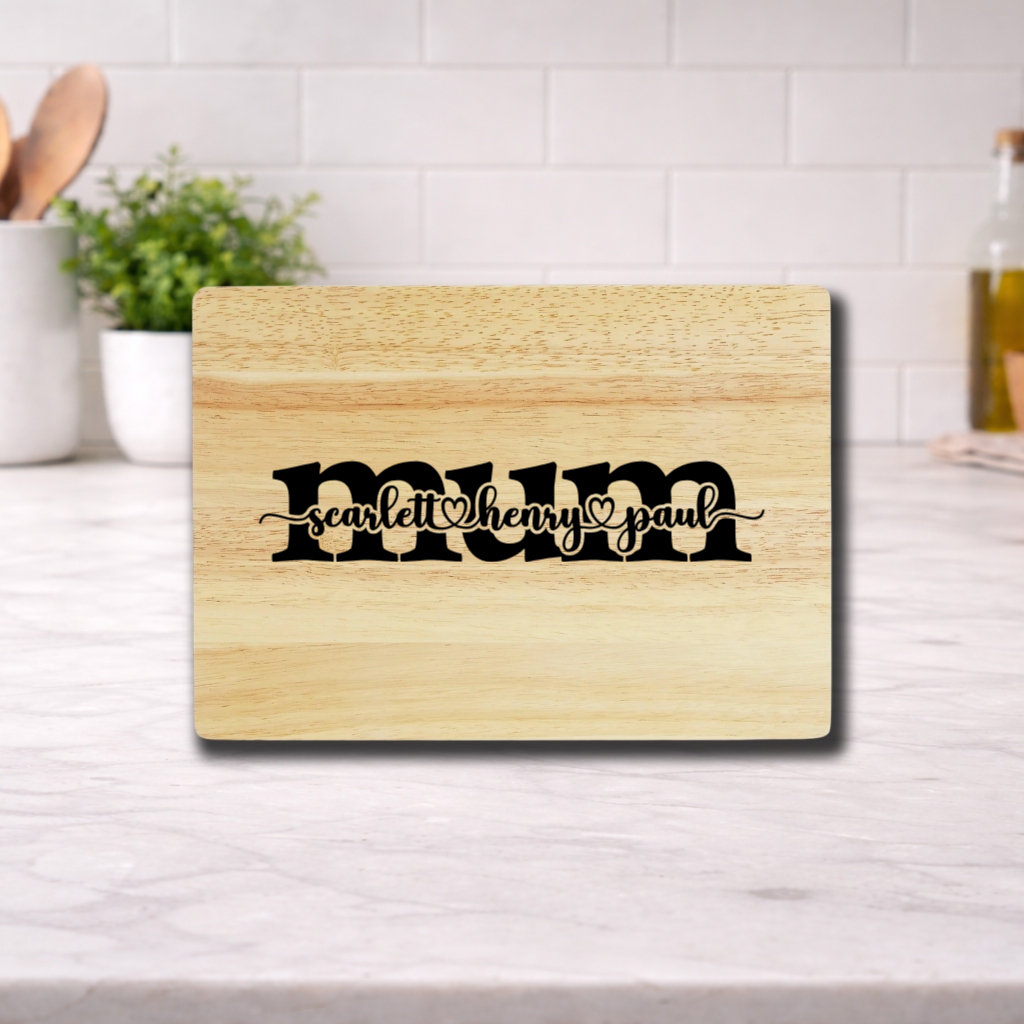 Personalized Mother’s Day Cutting Board with names scarlett, henry, and paul engraved on it.