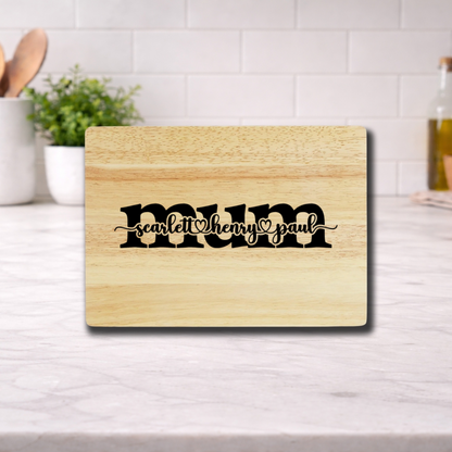 Personalized Mother’s Day Cutting Board with names scarlett, henry, and paul engraved on it.