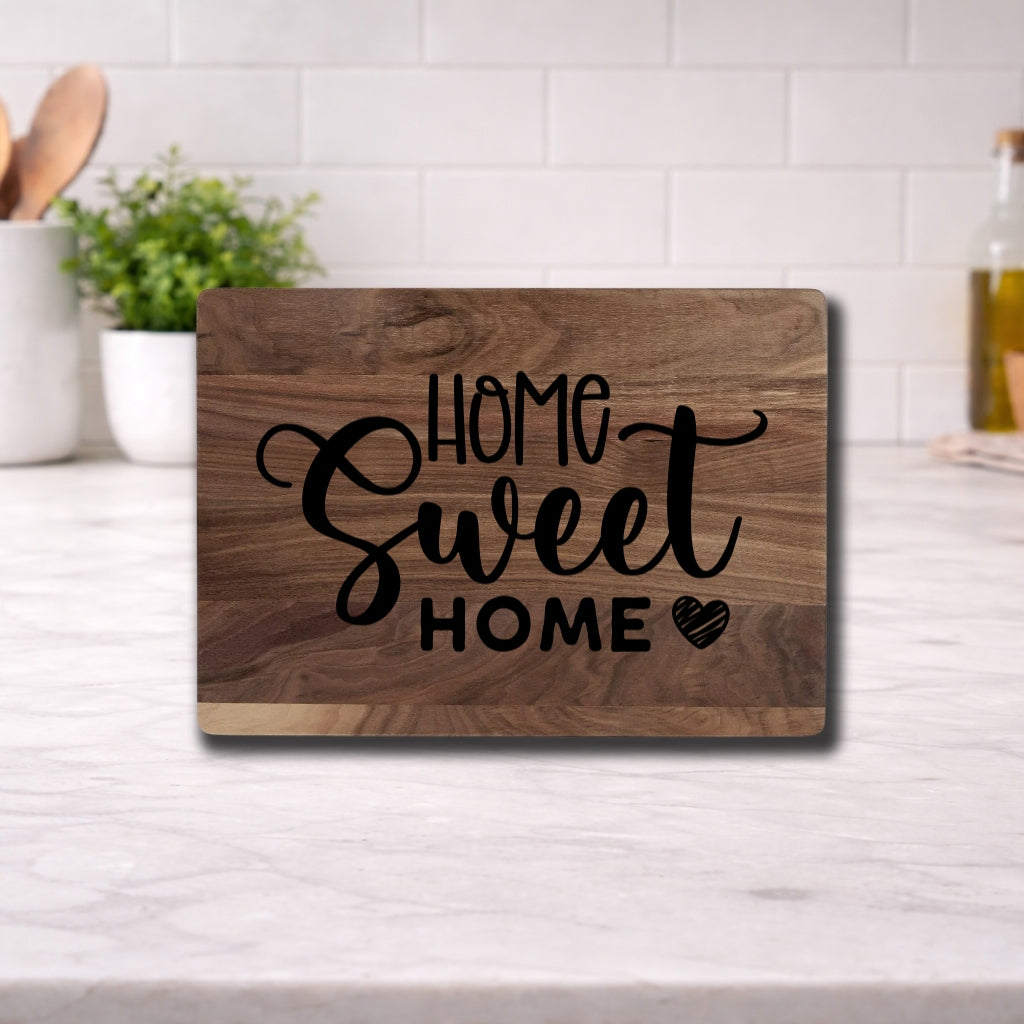 Engraved cutting board with the phrase 'home sweet home' beautifully designed for kitchen use.